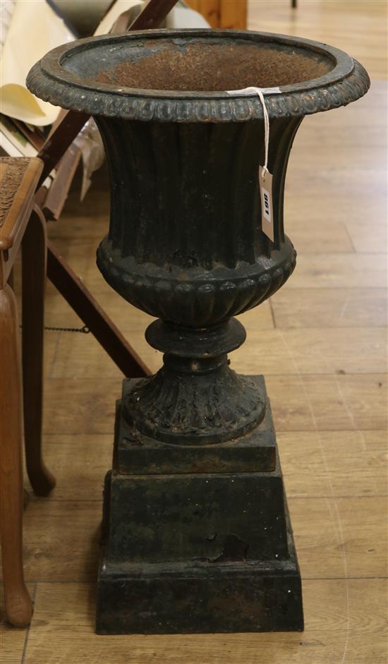A cast iron urn on stand W.38cm